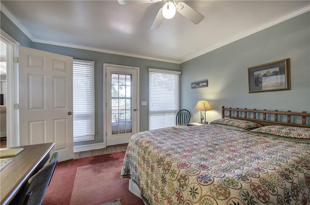 213 South View Trail Jasper, GA 30143 - Photo 37 of 79 a bedroom with a large bed and a chandelier