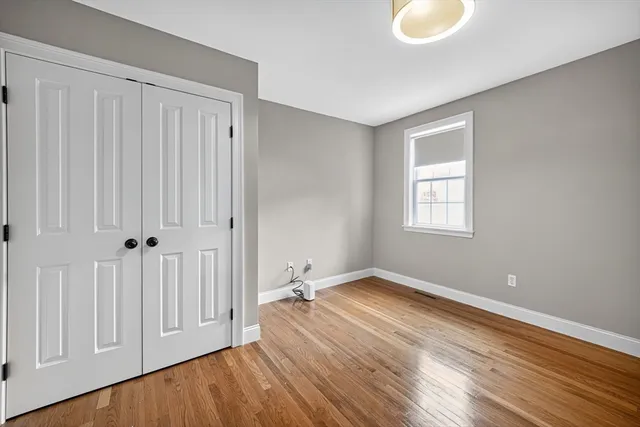 a view of a livingroom with wooden floor