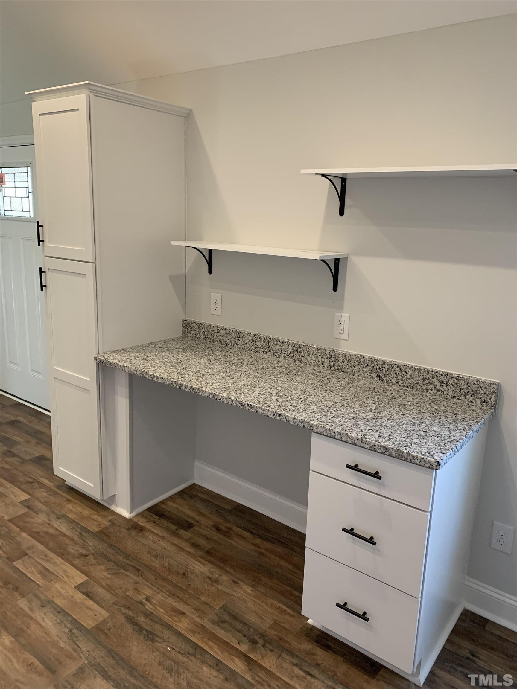 337 Chisenhall Road Angier, NC 27501 - Photo 3 of 7 a kitchen with granite countertop a sink and a refrigerator