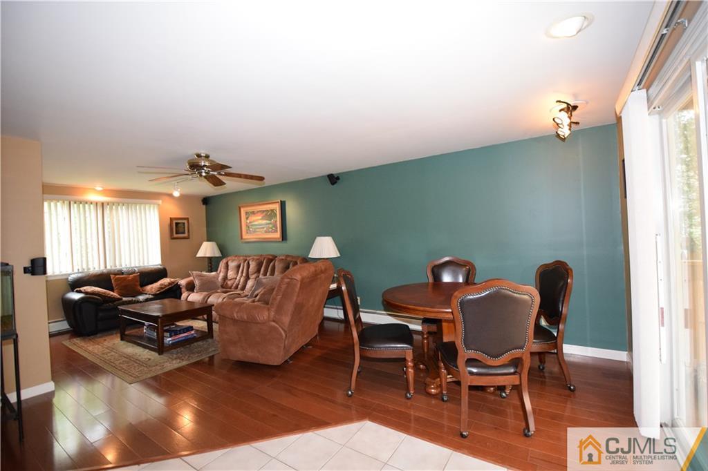 65 Warrenville Road Middlesex, NJ 08846 - Photo 13 of 22 a living room with furniture and wooden floor