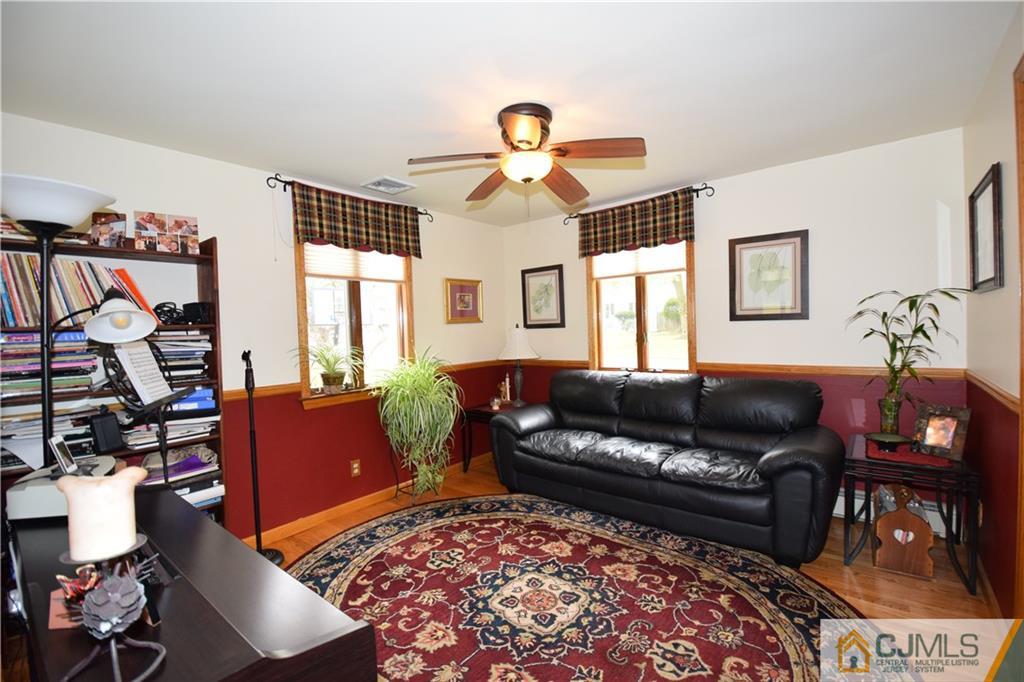 65 Warrenville Road Middlesex, NJ 08846 - Photo 18 of 22 a living room with furniture and a window