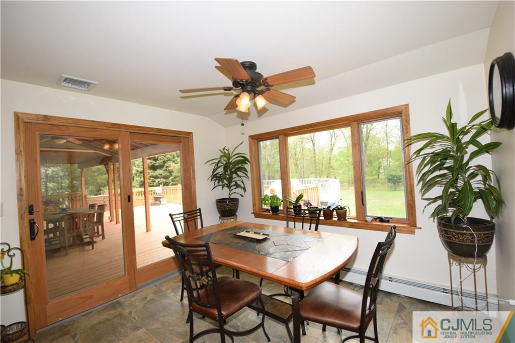 65 Warrenville Road Middlesex, NJ 08846 - Photo 10 of 22 a view of a dining room with furniture window and outside view
