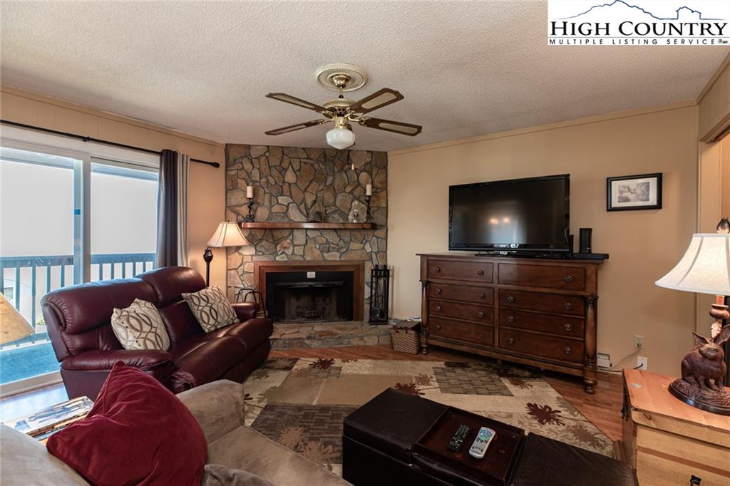 301 Pinnacle Inn Road, Unit 2316 Beech Mountain, NC 28604 - Photo 12 of 50 a living room with furniture and a flat screen tv
