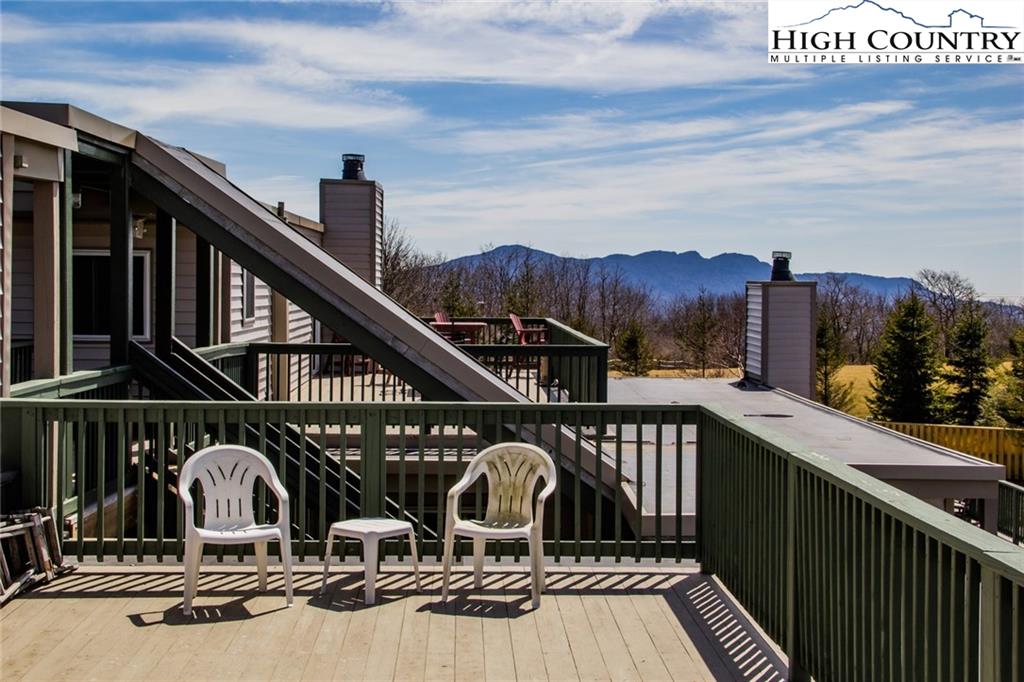 301 Pinnacle Inn Road, Unit 2316 Beech Mountain, NC 28604 - Photo 18 of 50 a view of balcony with two chairs and wooden floor