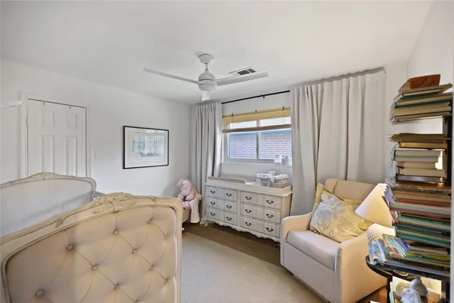 a bedroom with bed and window