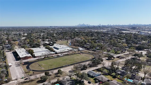 a house with huge green field in front of it