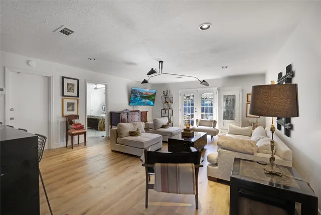 a living room with fireplace furniture and a flat screen tv