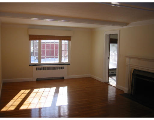 34 Janet Road Newton, MA 02459 - Photo 3 of 3 a view of an empty room with wooden floor and a window