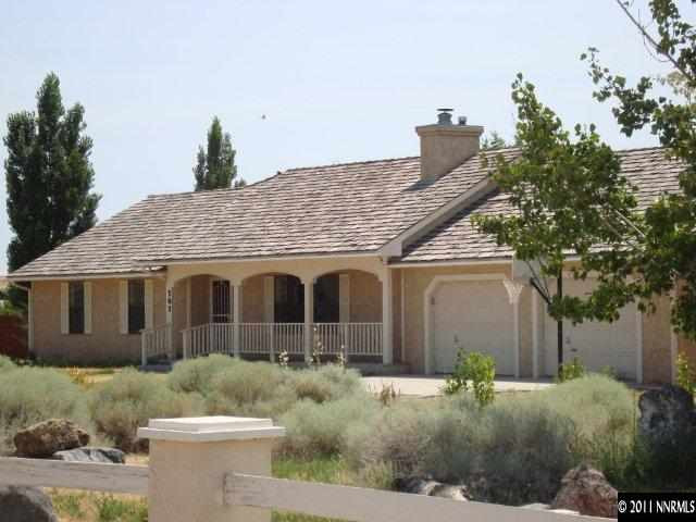 303 Rice Road Fallon, NV 89406 - Photo 1 of 13 a front view of a house with a yard and garage