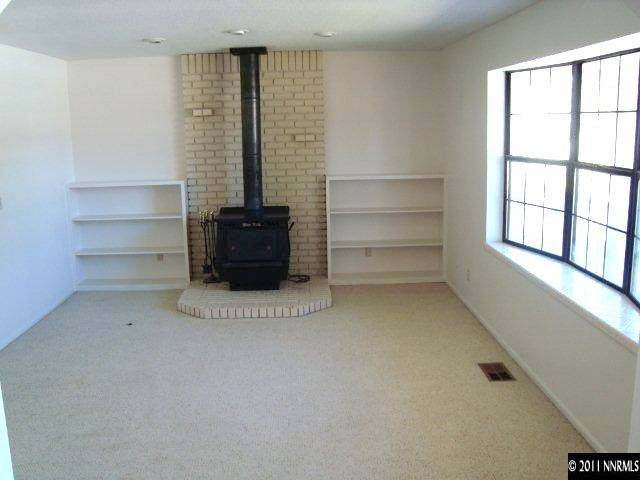 303 Rice Road Fallon, NV 89406 - Photo 2 of 13 a view of an empty room with a window