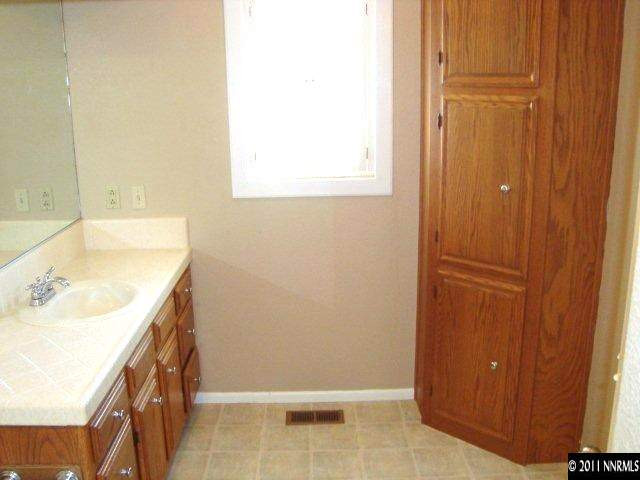 303 Rice Road Fallon, NV 89406 - Photo 7 of 13 a bathroom with a sink and a bathtub