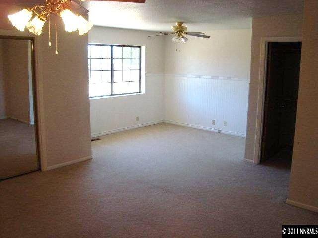 303 Rice Road Fallon, NV 89406 - Photo 8 of 13 an empty room with windows and closet