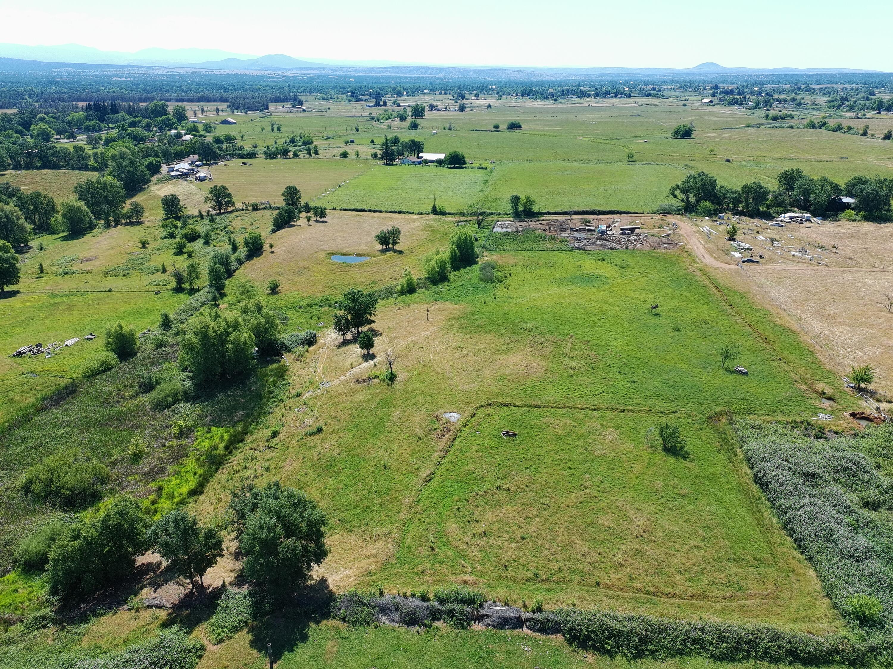 5227 Hopson Road Anderson, CA 96007 - Photo 4 of 19 an aerial view of a golf course with a lake view
