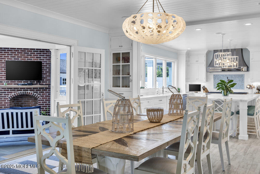 15 Madison Avenue Spring Lake, NJ 07762 - Photo 14 of 53 a view of a dining room with furniture a chandelier and wooden floor