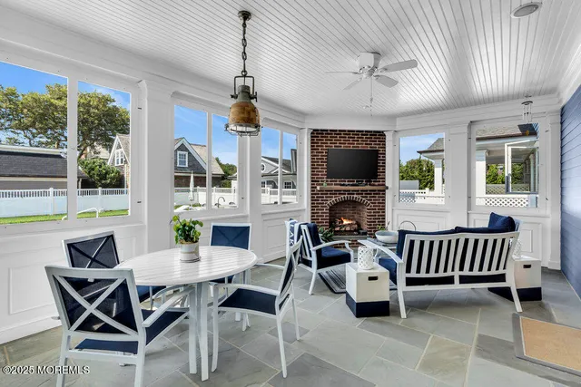 a view of a dining room with furniture wooden floor and chandelier