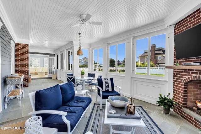 a living room with furniture fireplace and flat screen tv
