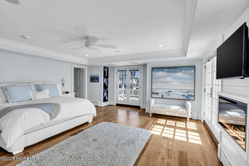 15 Madison Avenue Spring Lake, NJ 07762 - Photo 23 of 53 a bedroom with a bed and a flat screen tv