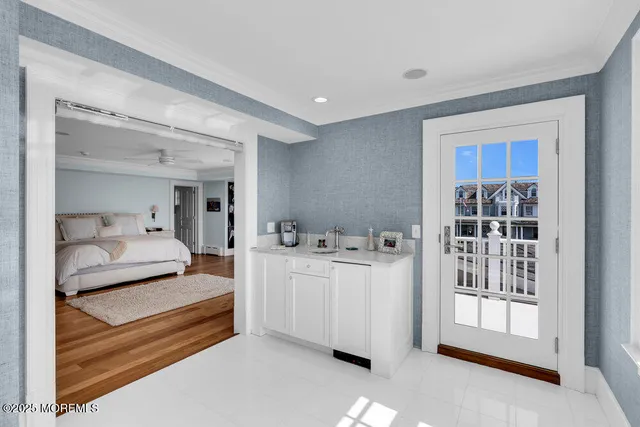 a spacious bathroom with a double vanity sink a large mirror and a bathtub