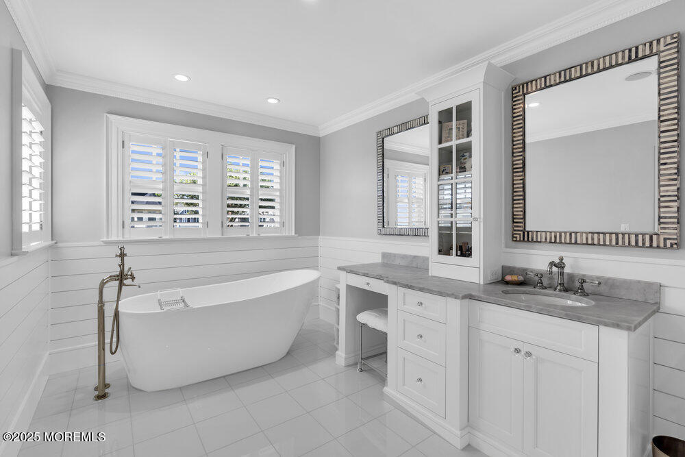 15 Madison Avenue Spring Lake, NJ 07762 - Photo 27 of 53 a spacious bathroom with a double vanity sink large mirror and a bathtub