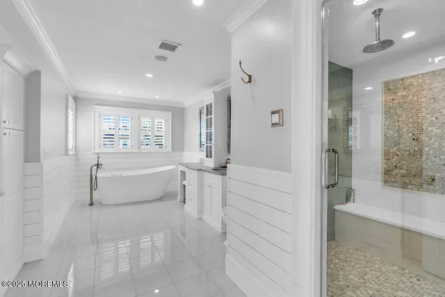a bathroom with a granite countertop toilet sink and mirror