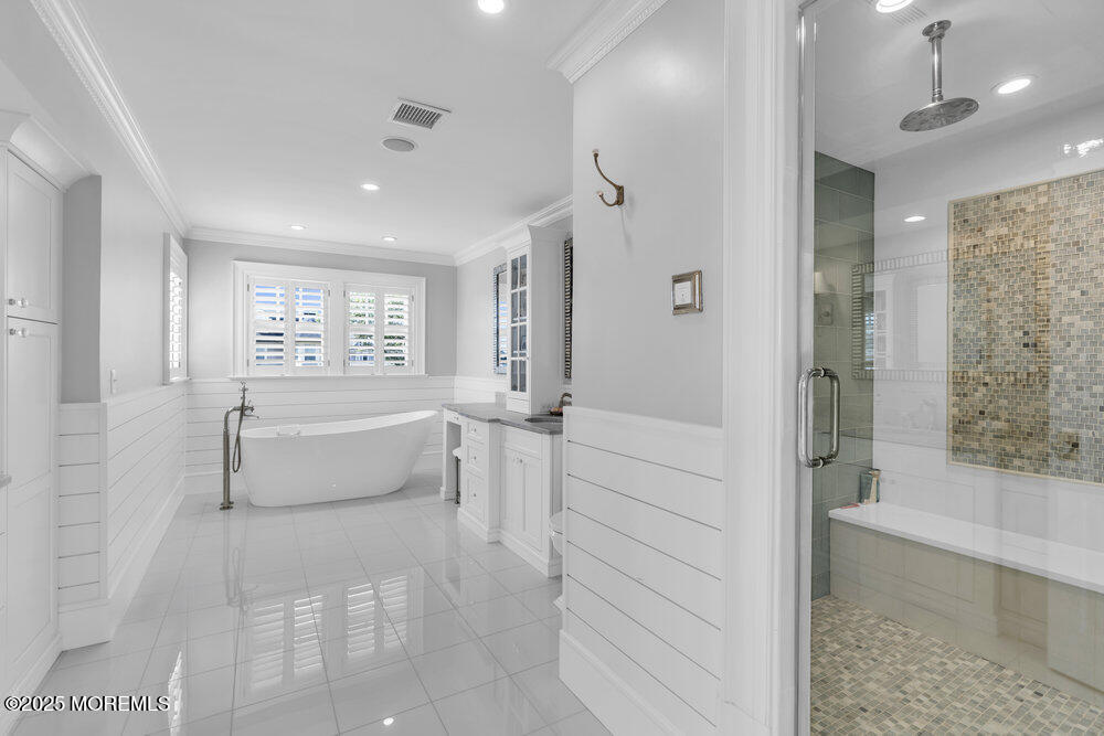 15 Madison Avenue Spring Lake, NJ 07762 - Photo 29 of 53 a bathroom with a bathtub and a shower