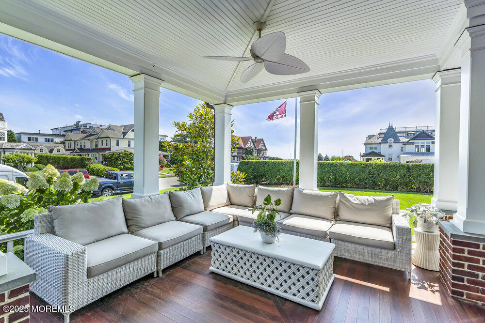 15 Madison Avenue Spring Lake, NJ 07762 - Photo 3 of 53 a living room with patio furniture and a floor to ceiling window
