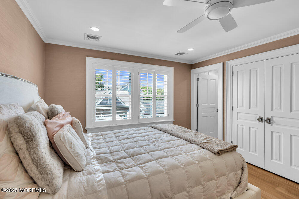 15 Madison Avenue Spring Lake, NJ 07762 - Photo 32 of 53 a spacious bedroom with a bed and a window