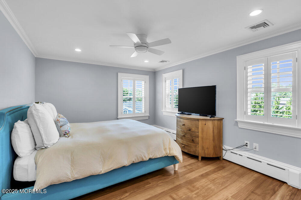 15 Madison Avenue Spring Lake, NJ 07762 - Photo 34 of 53 a bedroom with a bed and a flat screen tv