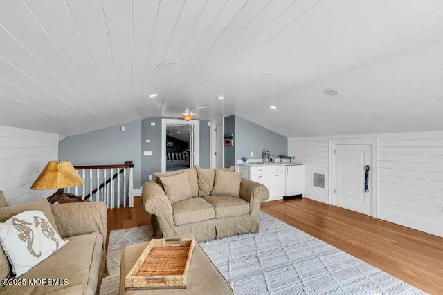 a bathroom with a granite countertop toilet sink and mirror