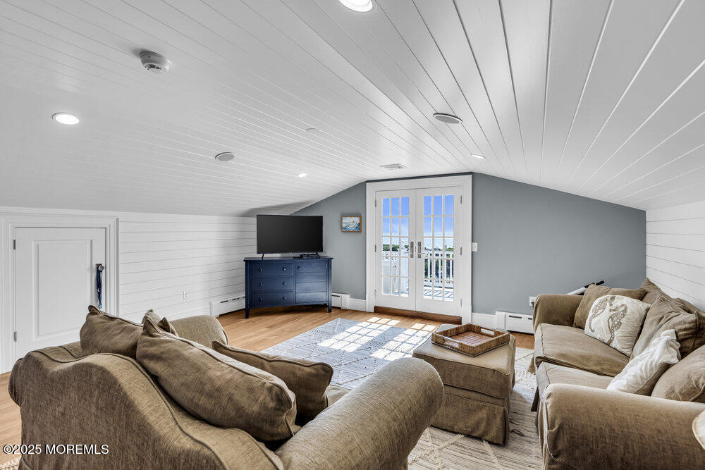 15 Madison Avenue Spring Lake, NJ 07762 - Photo 42 of 53 a living room with furniture a flat screen tv and a couch