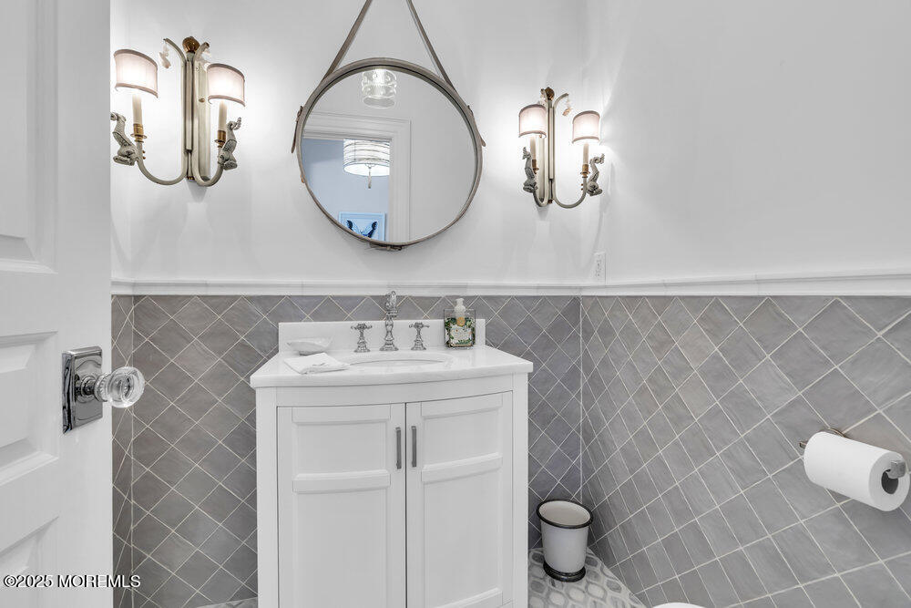15 Madison Avenue Spring Lake, NJ 07762 - Photo 45 of 53 a bathroom with a sink and a mirror