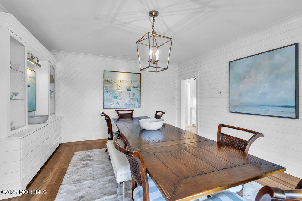 15 Madison Avenue Spring Lake, NJ 07762 - Photo 46 of 53 a view of a dining room with furniture wooden floor and a chandelier
