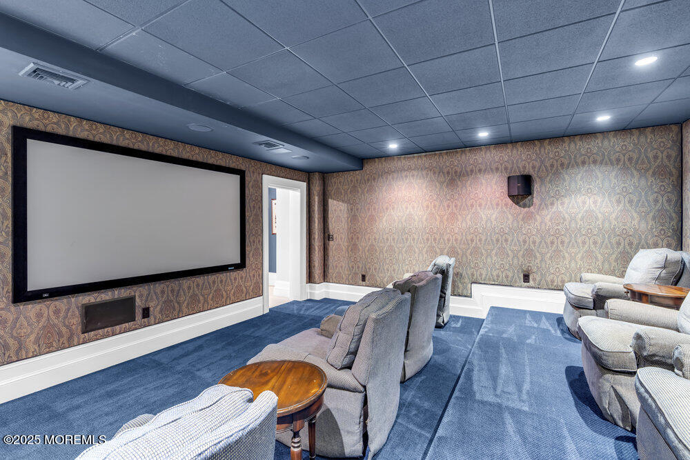 15 Madison Avenue Spring Lake, NJ 07762 - Photo 48 of 53 a living room with furniture and a flat screen tv