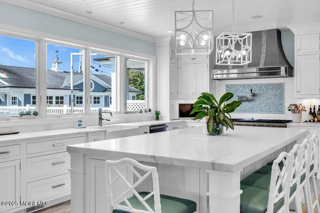 a view of kitchen and sink with wooden floor
