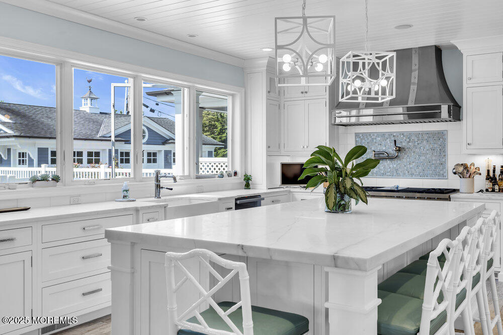 15 Madison Avenue Spring Lake, NJ 07762 - Photo 10 of 53 a kitchen with a table and chairs in it