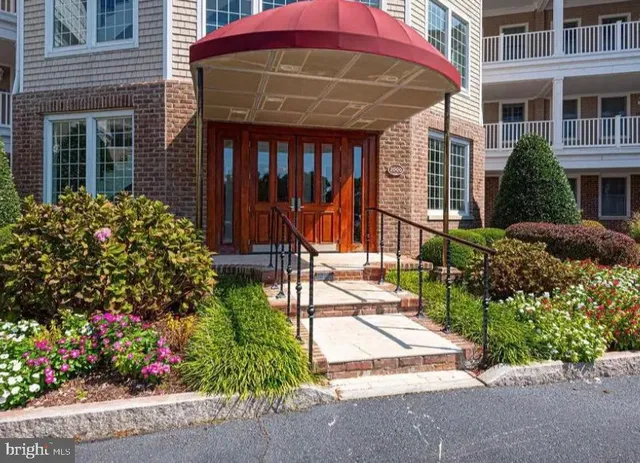 a view of a hallway with wooden walls and door