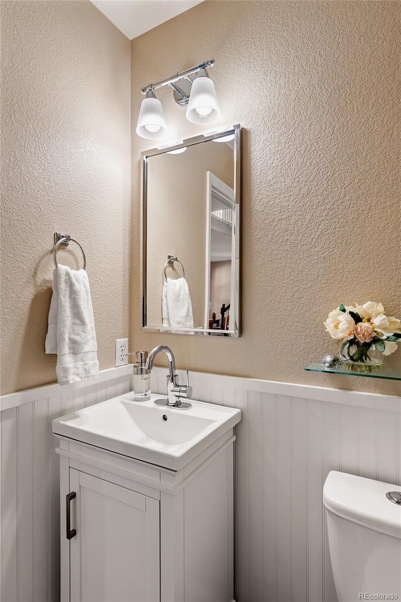 9441 South Hackberry Lane Highlands Ranch, CO 80129 - Photo 43 of 50 a bathroom with a sink vanity and a toilet