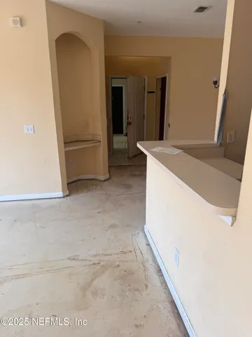 a view of a refrigerator in a kitchen