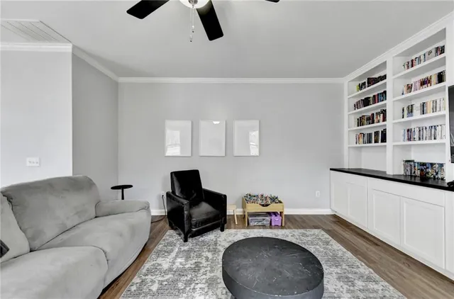 a living room with furniture and a rug