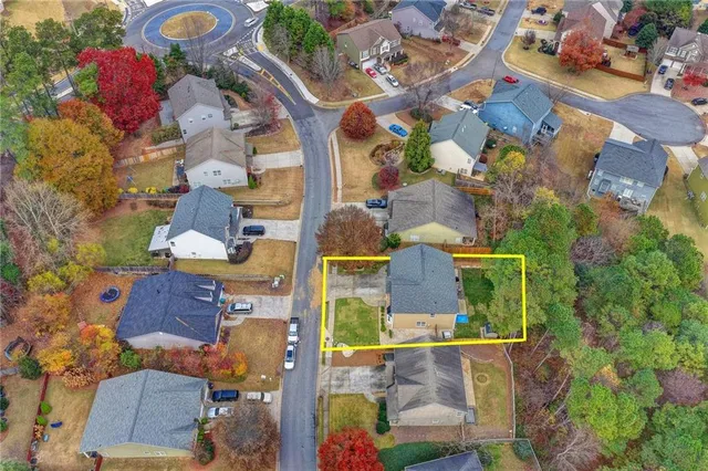 an aerial view of houses outdoor space and swimming pool