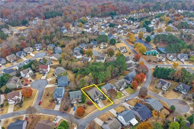an aerial view of residential houses with outdoor space