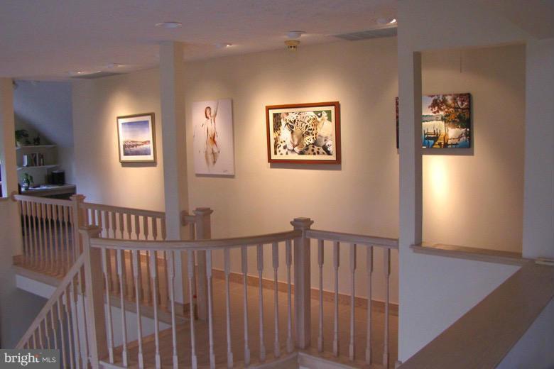 8442 Mackall Road St. Leonard, MD 20685 - Photo 14 of 30 Upper level hall way and gallery wall