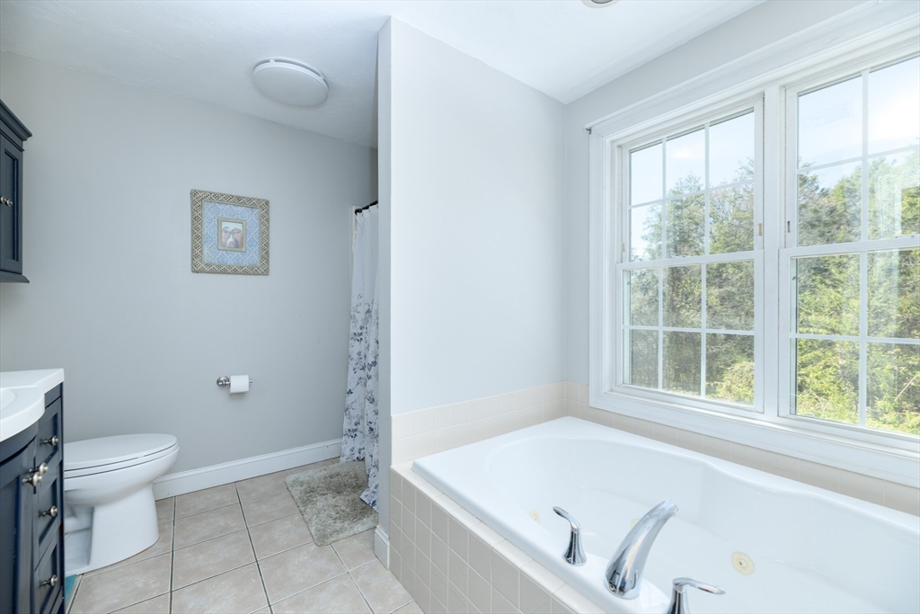 27 Vista Circle Rutland, MA 01543 - Photo 17 of 35 a bathroom with a tub and a toilet