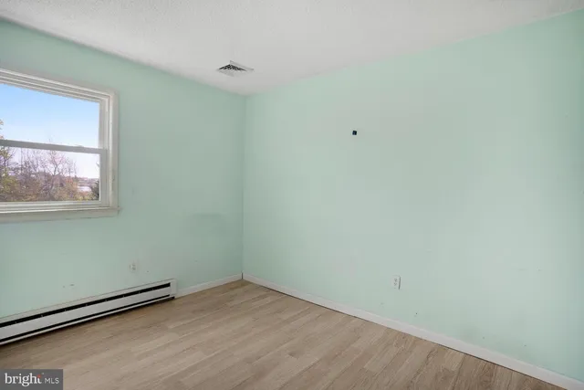 a view of a room that has a window