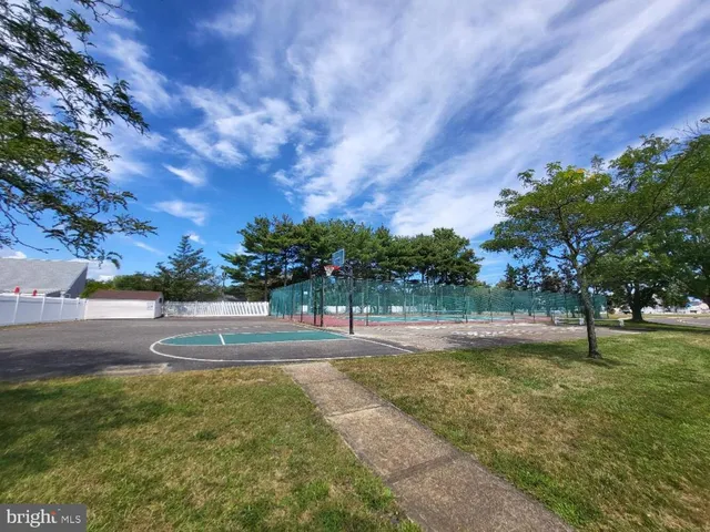 a view of swimming pool is middle in the garden