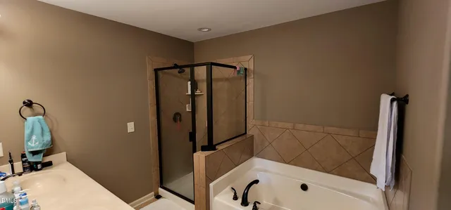 a bathroom with a tub and a sink