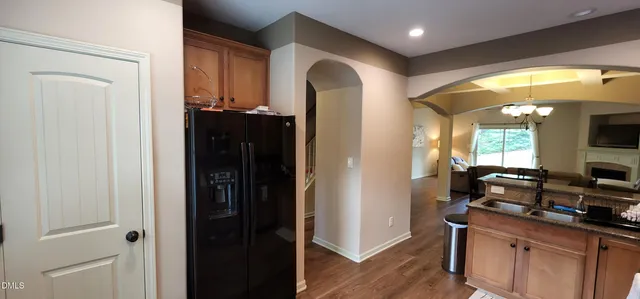 a hallway with sink and mirror