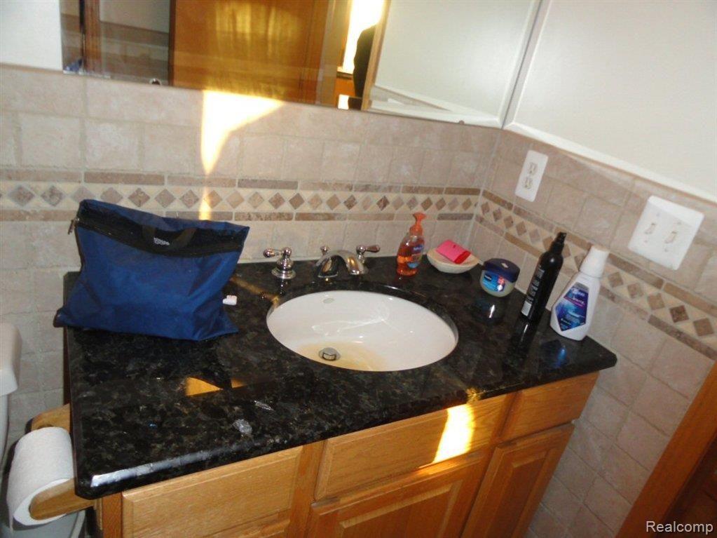 5676 Hessen Road Casco, MI 48064 - Photo 10 of 19 HALL BATH SINK.JPG