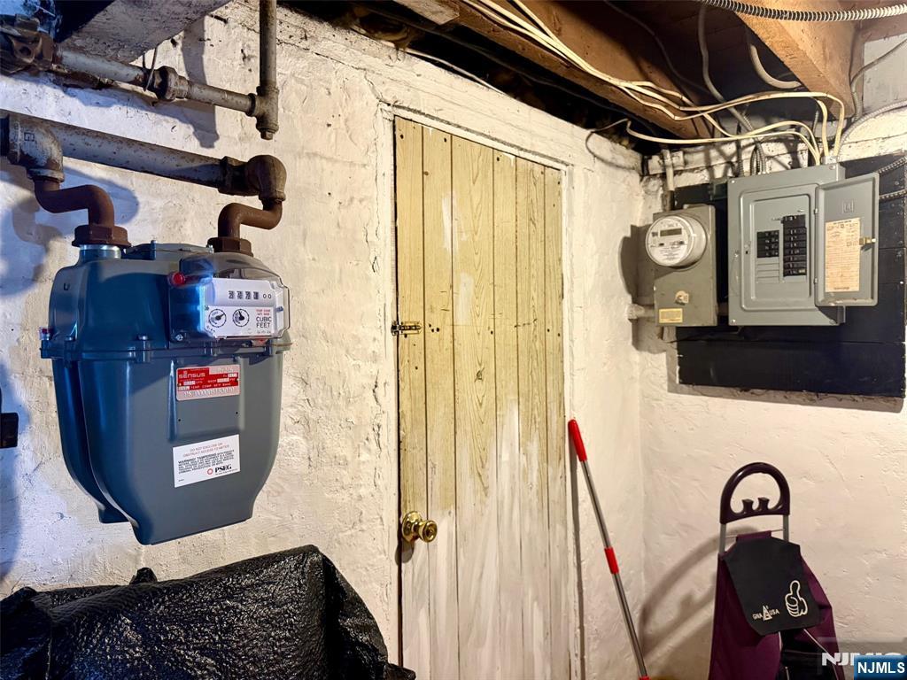 405 7th Street Harrison, NJ 07029 - Photo 16 of 21 a bathroom with a sink and a mirror