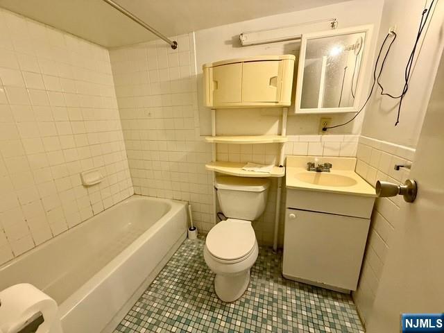 405 7th Street Harrison, NJ 07029 - Photo 19 of 21 a bathroom with a toilet and a shower